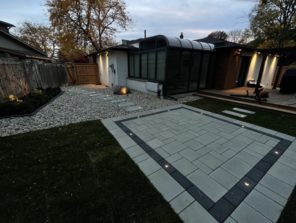 Backyard Renovation in Oakville: Transforming Outdoor Spaces with Interlock, Landscape Lighting & Sprinkler Systems